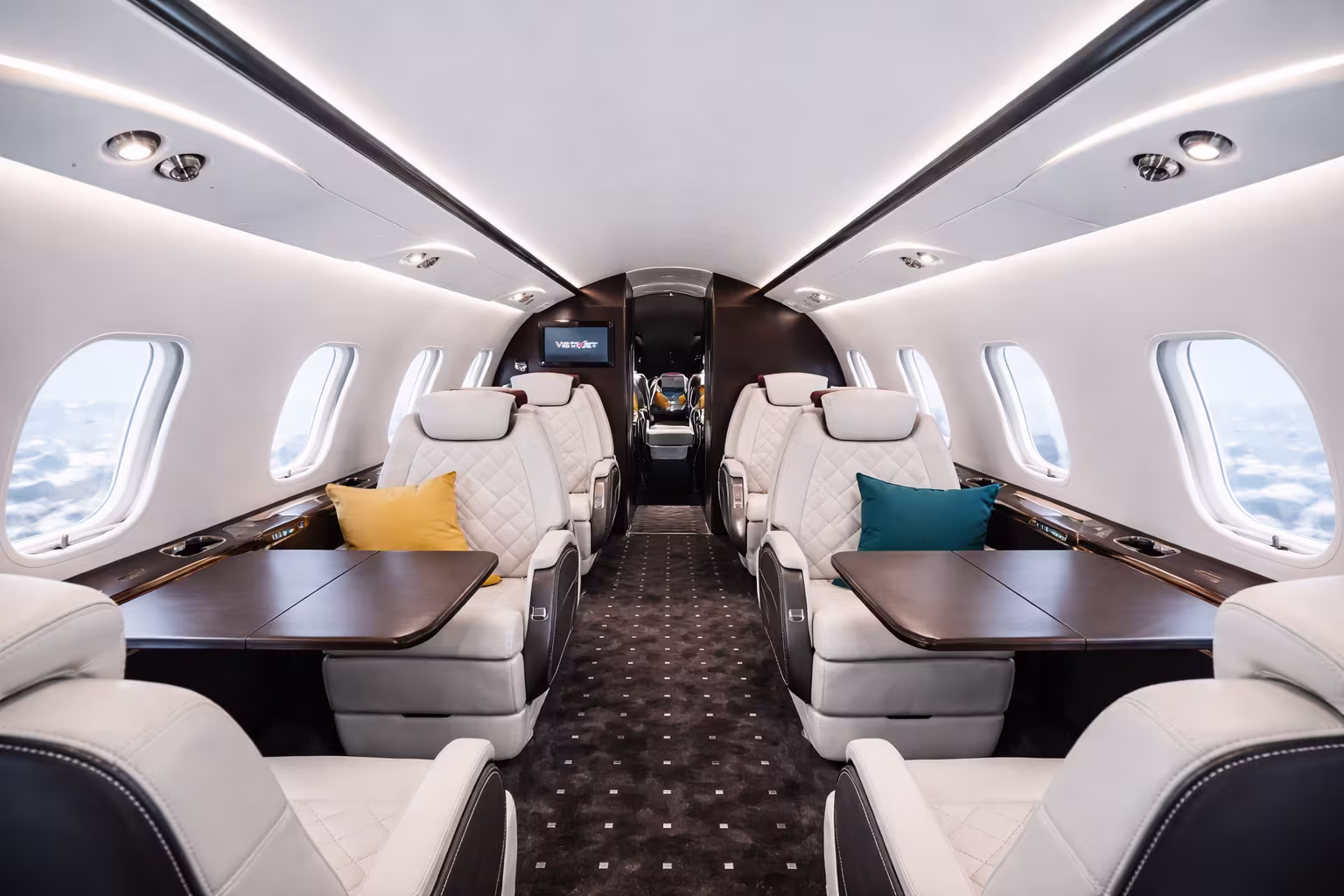 Super midsize jet interior cabin with flat floor and executive seating for Cancun private charter