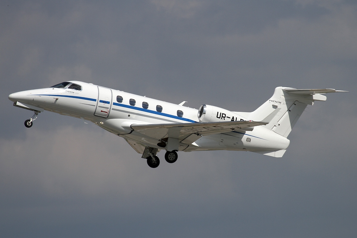 Embraer Phenom 300 light jet on runway ready for private charter flight to Cancun